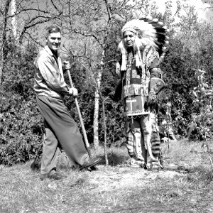 Charles Sauriol and Jasper Hill, also known as 'Chief Big White Owl', planting a tree